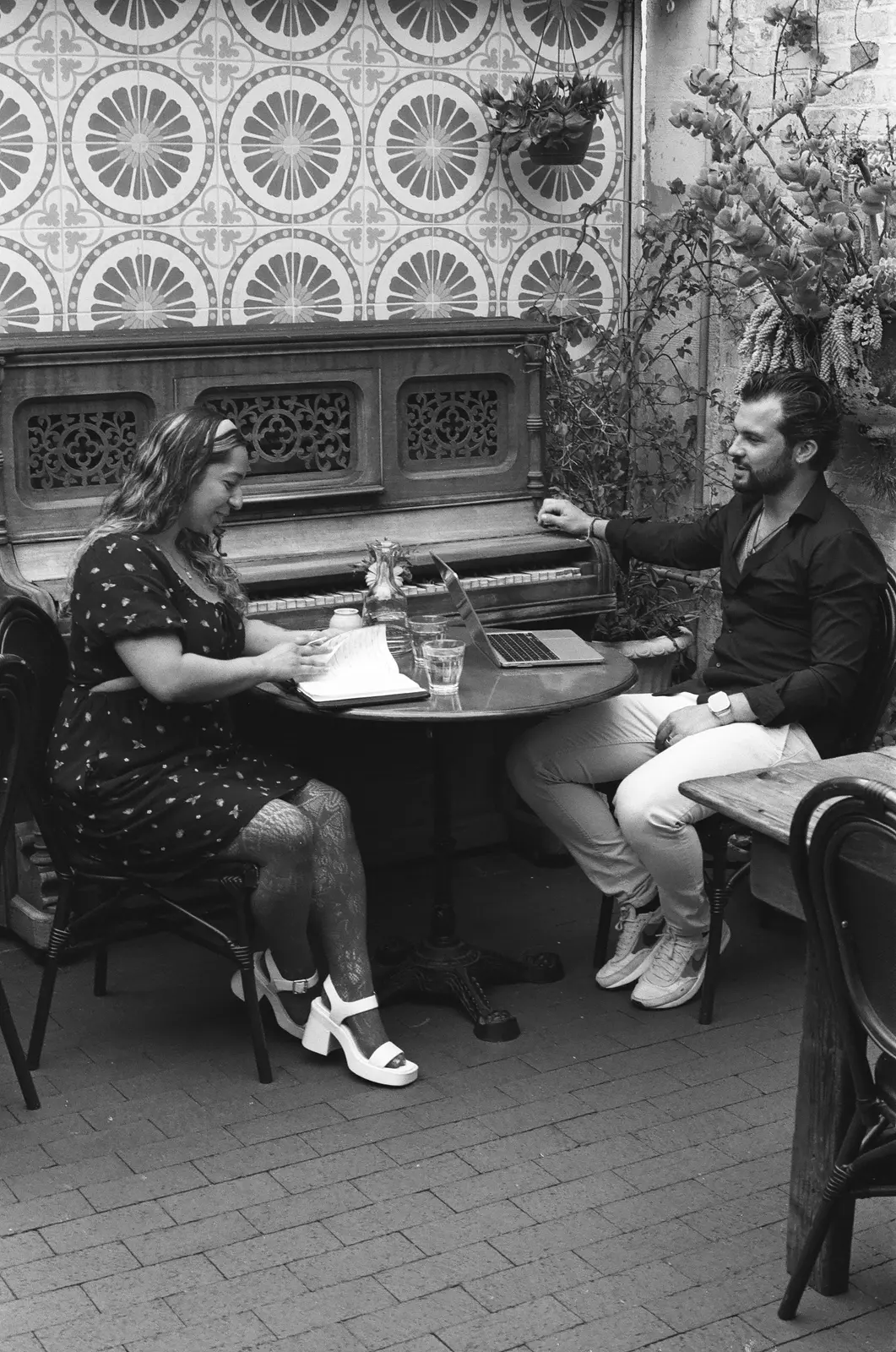 Lucas in conversation at a restaurant table